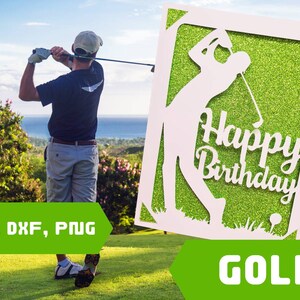 May include: A white card with a silhouette of a golfer swinging a club. The card has a green glitter background and the text "Happy Birthday" in white. The card is on a green grassy surface.