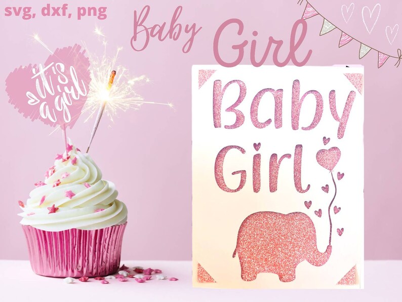 Puede incluir: Un cupcake rosa y blanco con chispas rosas y una parte superior en forma de coraz&oacute;n rosa que dice "It's a girl" con una chispa en la parte superior. Un letrero blanco con letras de brillo rosa dice "Baby Girl" con un elefante de brillo rosa y corazones rosas.