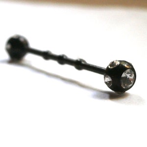 May include: Black barbell with clear crystal accents on each end.