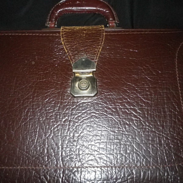 Dark brown leather briefcase, metal frame, free standing,, board level documents, heirloom statement,excellent condition, 3 clasp adjusments