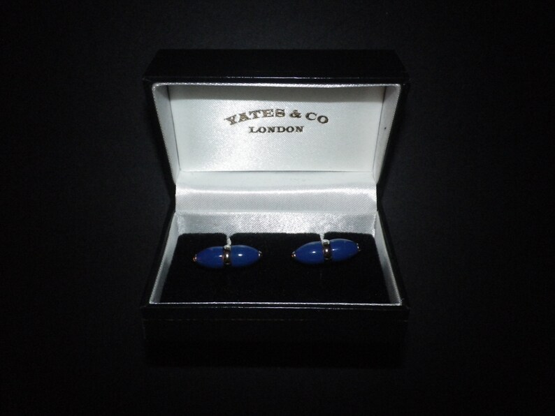 Beautiful rich dark royal blue cigar design ceramic cufflink set on high polished stainless steel,swivel shank action,lovely piece.