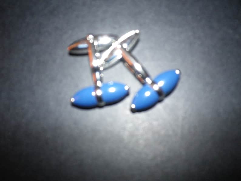 Beautiful rich dark royal blue cigar design ceramic cufflink set on high polished stainless steel,swivel shank action,lovely piece.