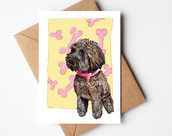 Chocolate Cockerpoo greeting card, pink and cream bones background, brown cockerpoo card, cockerpoo dog card with a pink heart collar