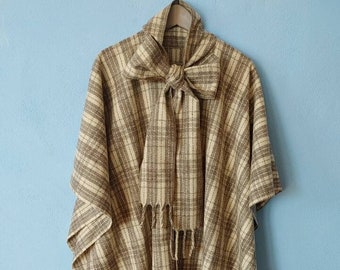 tartan grey wool poncho with bow and fringes. long wool cape with buttons and tie. vintage mexican poncho in bohemian style. present