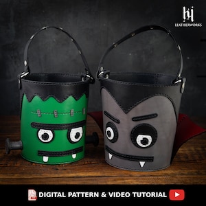 May include: Two Halloween trick-or-treat buckets made of leather. One bucket is green with a Frankenstein face and the other is gray with a vampire face.  The buckets have black leather handles and are decorated with white stitching.  DIGITAL PATTERN & VIDEO TUTORIAL
