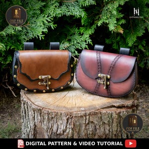 Puede incluir: Dos bolsos de cuero con cierres metálicos color latón y trabillas para cinturón. Uno es de color tostado con bordes negros y remaches dorados, mientras que el otro es de color burdeos oscuro con detalles de cuero trenzado y solapa.