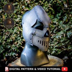May include: A metallic grey leather helmet with a skull-like design, featuring riveted details and a visor with vertical slits. The image shows the text "DXF FILE LEATHER PATTERN", "PDF FILE LEATHER PATTERN", and "DIGITAL PATTERN & VIDEO TUTORIAL".