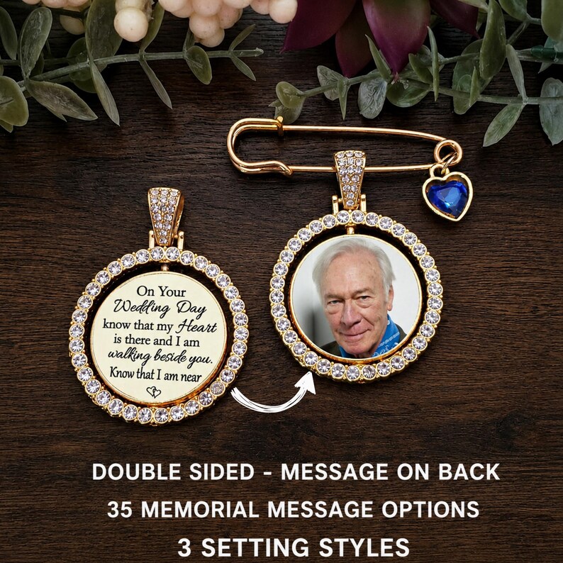 May include: A gold-toned memorial brooch featuring a circular frame encrusted with clear crystals. One side displays a photograph of an older man, while the other side features the text: On Your Wedding Day know that my Heart is there and I am walking beside you. Know that I am near.