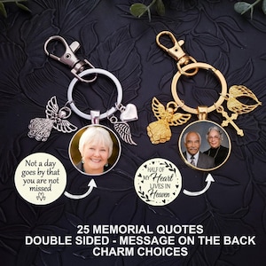 May include: Two memorial keychains with photo pendants and decorative charms. One keychain is silver with a photo of a woman, the other is gold with a photo of a couple. Text includes "Not a day goes by that you are not missed" and "Half of my heart lives in Heaven."