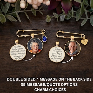 May include: Two gold-tone safety pin brooches featuring circular photo pendants. One pendant shows a woman with glasses, the other a man. Each has a matching circular charm with memorial text. One pin has a blue teardrop charm, the other a gold heart.