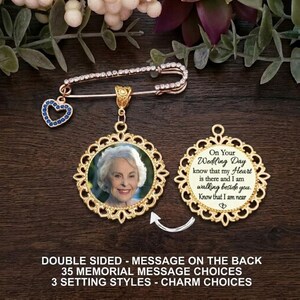May include: A gold-toned brooch featuring a safety pin with a small blue heart charm and a circular pendant. The pendant displays a portrait of an older woman on one side and text on the other that reads: On Your Wedding Day know that my Heart is there and I am walking beside you. Know that I am near.
