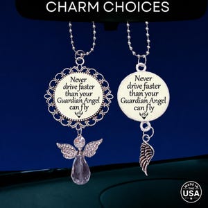 May include: Two silver-toned car charms hanging from ball chains. Each charm features a round pendant with the text 'Never drive faster than your Guardian Angel can fly' and a small angel icon. One pendant has a filigree border and crystal angel.