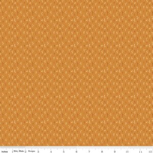 May include: A seamless fabric pattern with a repeating design of small, stylized branches in shades of orange and yellow on a mustard yellow background.