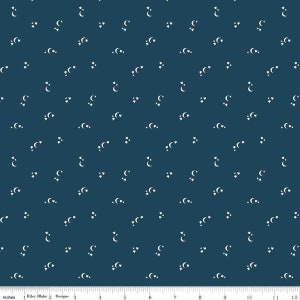 May include: A dark blue fabric with a white repeating pattern of crescent moons and stars.