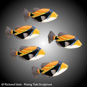 May include: Five colorful, hand-painted fish sculptures with orange, yellow, black, white, and blue details. The fish are arranged in a staggered pattern, with their tails pointing in different directions. The sculptures are made of wood and have a realistic appearance.