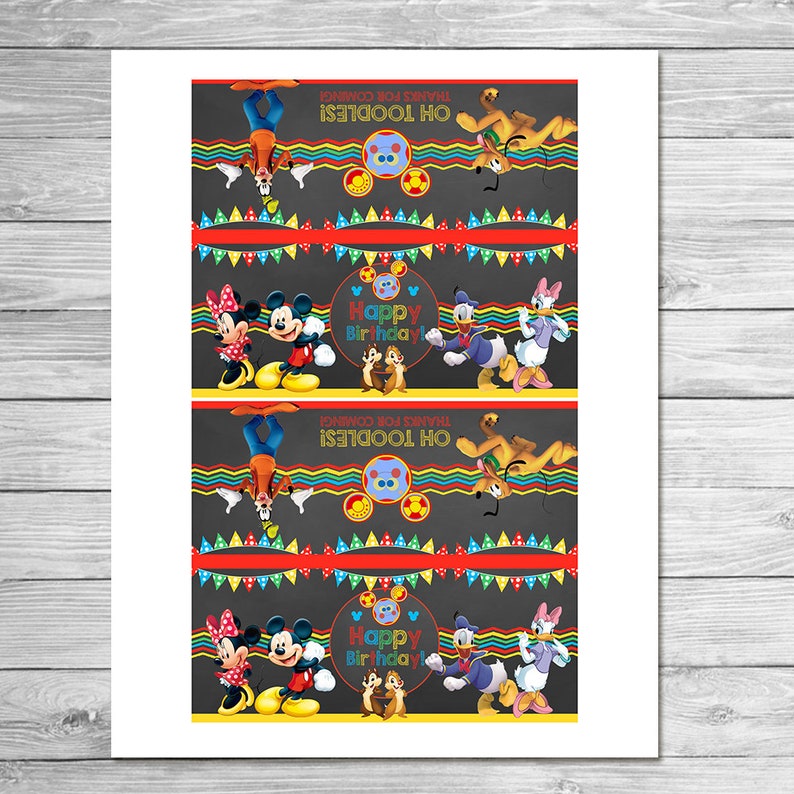 May include: A sheet of paper featuring a repeating pattern of Disney characters. Mickey and Minnie Mouse, Donald and Daisy Duck, and Chip and Dale are depicted. The words "Happy Birthday!" and "Oh Toodles! Thanks for Coming!" are also visible.