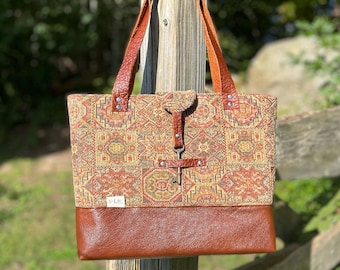 Tapestry and leather handbag