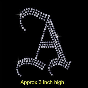 May include: A sparkly silver letter A made of rhinestones, approximately 7.6 cm high.