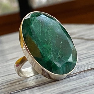 Emerald silver ring with a large oval shaped green gemstone  set in sterling silver