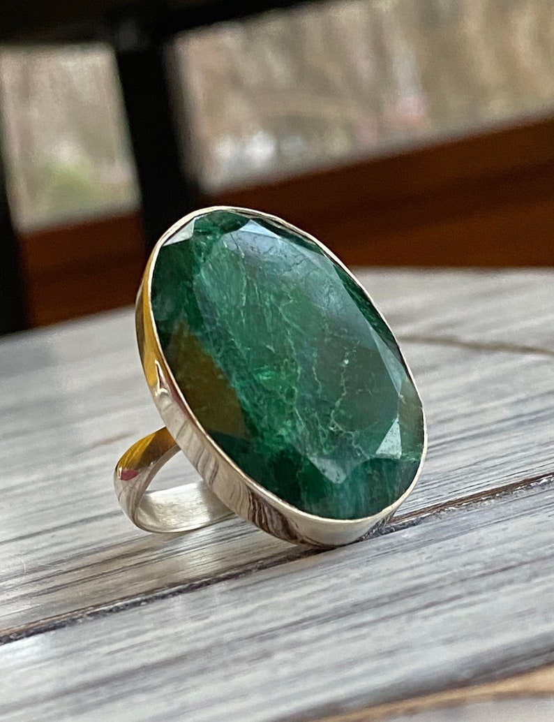 Emerald silver ring with a large oval shaped green gemstone  set in sterling silver
