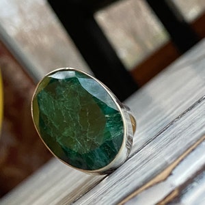 Emerald ring bezel set in 925 sterling silver with a large, oval-shaped green gemstone - faceted cut cabochon ring in adjustable band and size - May birthstone ring for women with matching earrings pendant necklace set