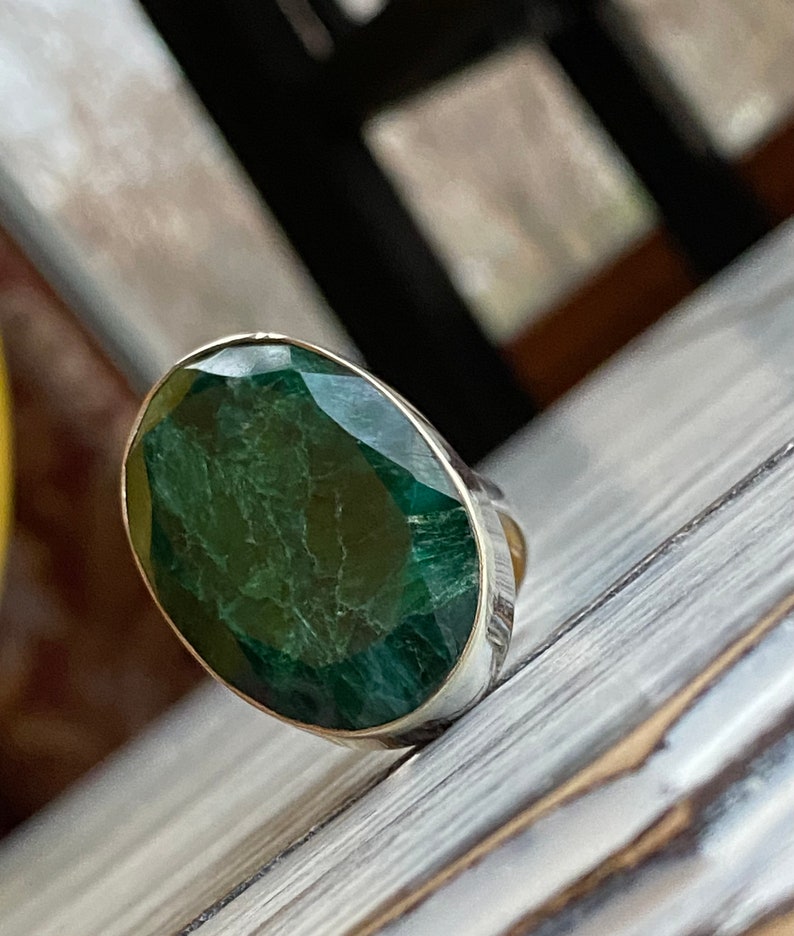 Emerald ring bezel set in 925 sterling silver with a large, oval-shaped green gemstone - faceted cut cabochon ring in adjustable band and size - May birthstone ring for women with matching earrings pendant necklace set