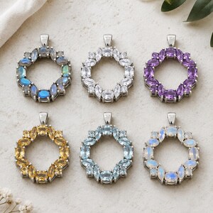 May include: Six gemstone pendant necklaces in a circular wreath design. The pendants feature various gemstones, including blue, white, purple, yellow, and light blue, set in silver-toned metal. Each pendant has a loop for a chain.