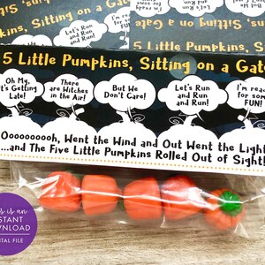 May include: A printable Halloween treat bag with a black background and white text. The text reads "5 Little Pumpkins, Sitting on a Gate" and "Oooooooooh, Went the Wind and Out Went the Light...and The Five Little Pumpkins Rolled Out of Sight!" The bag contains five small orange pumpkin-shaped candies.