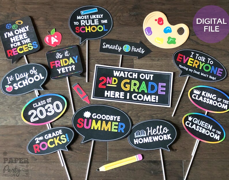 May include: A set of 12 printable photo booth props for a second grade classroom party. The props feature colorful text and graphics on a black chalkboard background. Some of the props include "I'm only here for the recess", "Is it Friday yet?", "Watch out 2nd grade here I come!" and "Goodbye Summer".