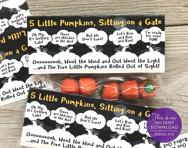 May include: A printable Halloween treat bag with a black and white design featuring the lyrics to the "Five Little Pumpkins" song. The bag is filled with five small orange pumpkin-shaped candies.