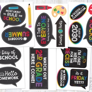 May include: A set of 12 printable photo booth props for a school-themed party. The props feature chalkboard-style designs with phrases like "Most Likely to Rule the School", "2nd Grade Rocks!" and "Is it Friday Yet?"
