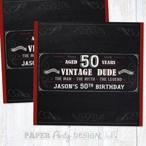 May include: Black and red birthday party invitation with a chalkboard background. The text reads "Premium Aged 50 Years - Vintage Dude - Limited Edition - The Man - The Myth - The Legend - Jason's 50th Birthday".