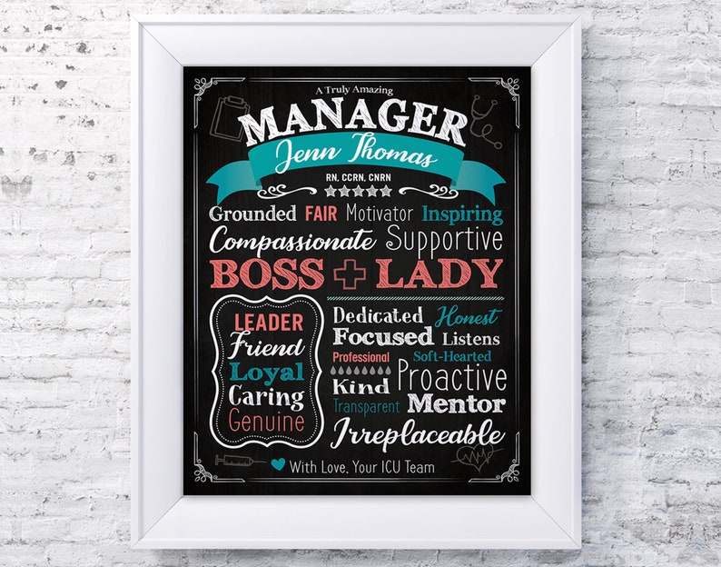 May include: A black and white chalkboard sign with a teal and red banner that reads "A Truly Amazing Manager Jenn Thomas RN, CCRN, CNRN". The sign has a list of positive attributes, including "Grounded, Fair, Motivator, Inspiring, Compassionate, Supportive, Boss + Lady, Dedicated, Honest, Friend, Focused, Listens, Loyal, Kind, Proactive, Caring, Transparent, Mentor, Genuine, Irreplaceable". The sign ends with "With Love, Your ICU Team".