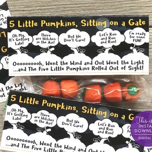 May include: A printable Halloween treat bag with a black and white design featuring the lyrics to the "Five Little Pumpkins" song. The bag is filled with five small orange pumpkin-shaped candies.