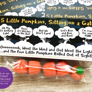 May include: A printable Halloween treat bag with a black background and white text. The text reads "5 Little Pumpkins, Sitting on a Gate" and "Oooooooooh, Went the Wind and Out Went the Light...and The Five Little Pumpkins Rolled Out of Sight!" The bag contains five small orange pumpkin-shaped candies.