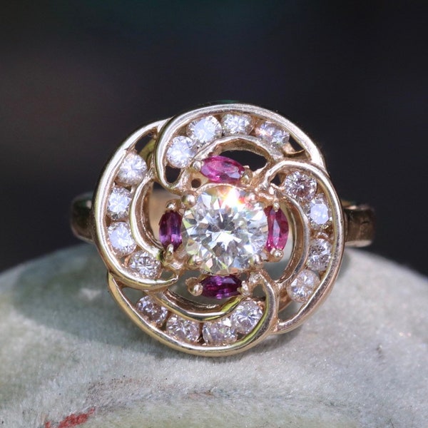 Transitional cut diamond set in 14k yellow gold surrounded by rubies and modern round diamonds size 5.75 (sizable)