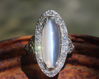 Genuine Art Deco moonstone ring with natural diamond halo set in platinum