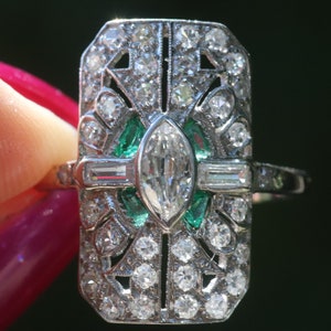 Art Deco cocktail ring with antique cut marquise, baguettes and emeralds set in 18k and platinum size 5.5 sizable