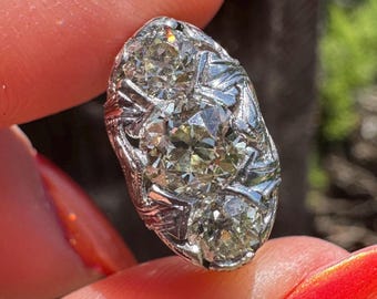 1.45 ctw old European cut diamond Edwardian three stone ring in platinum