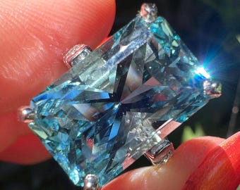 Giant precision cut aquamarine and diamond ring