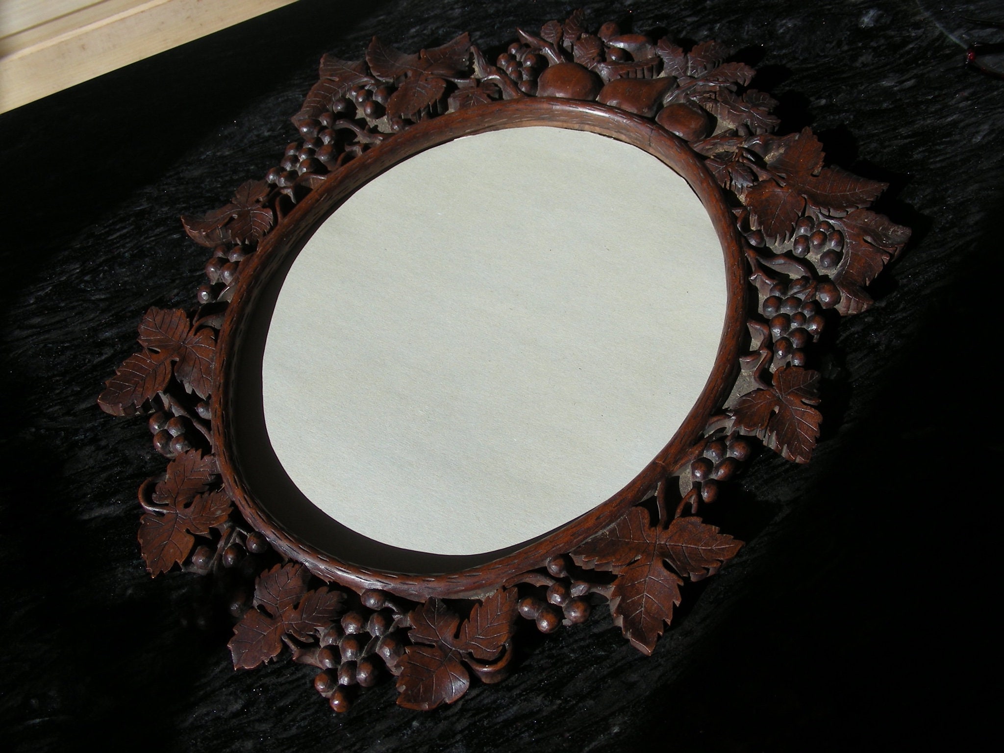 Beautifully carved, vintage, oak, oval mirror or picture frame, grapes and fruit, Brienz Switzerland