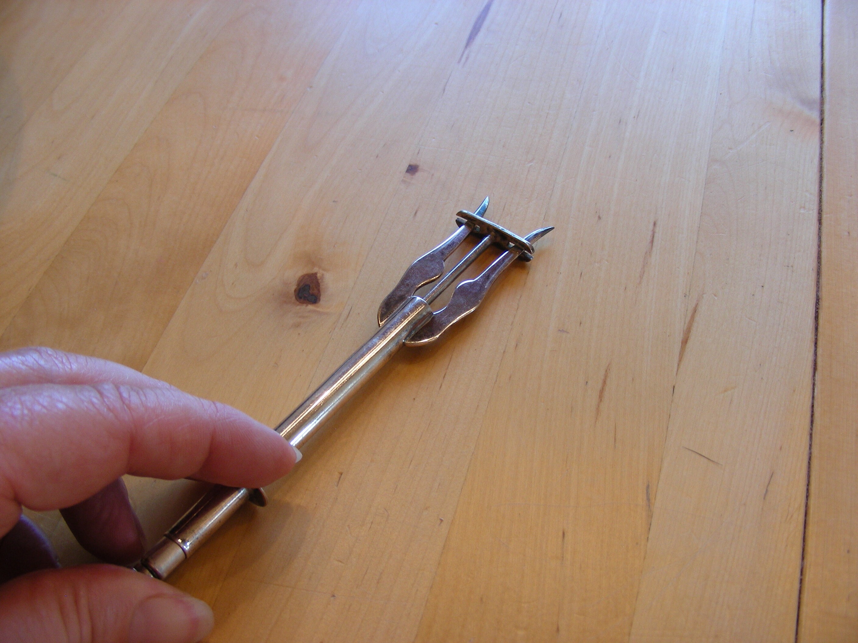 Spring loaded pickle fork, silver plated vintage