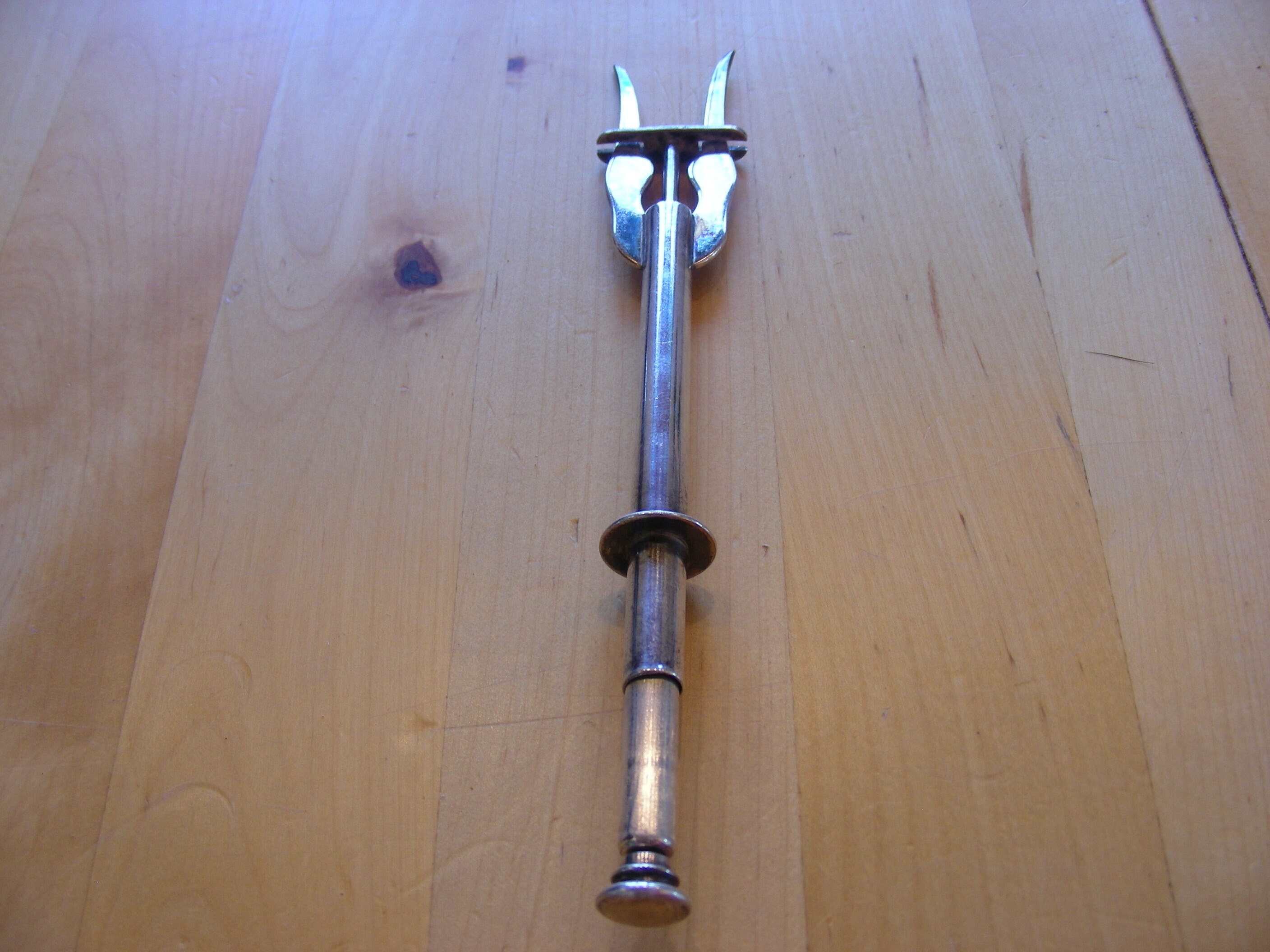 Spring loaded pickle fork, silver plated vintage