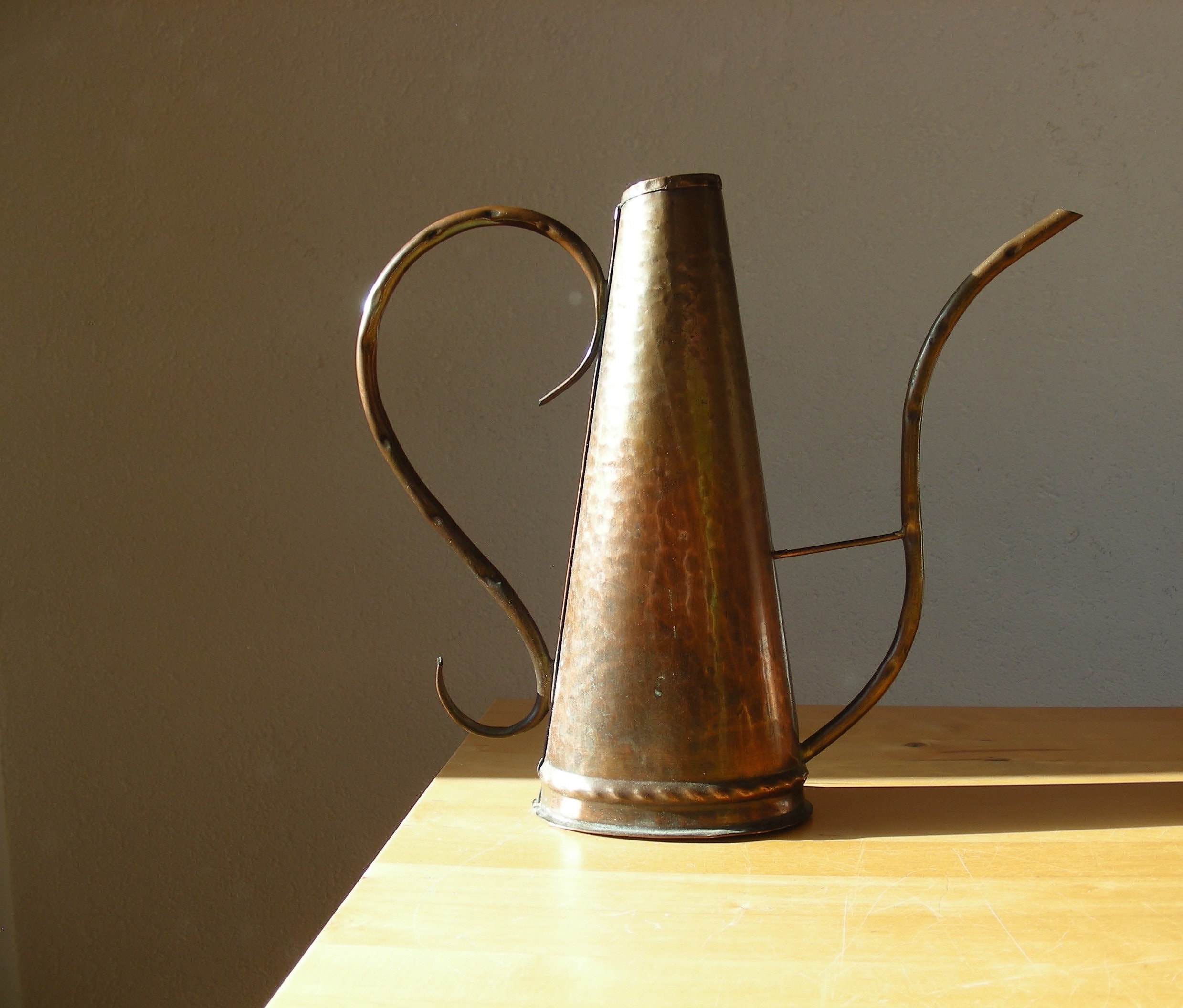 Vintage copper watering can tall triangular shape