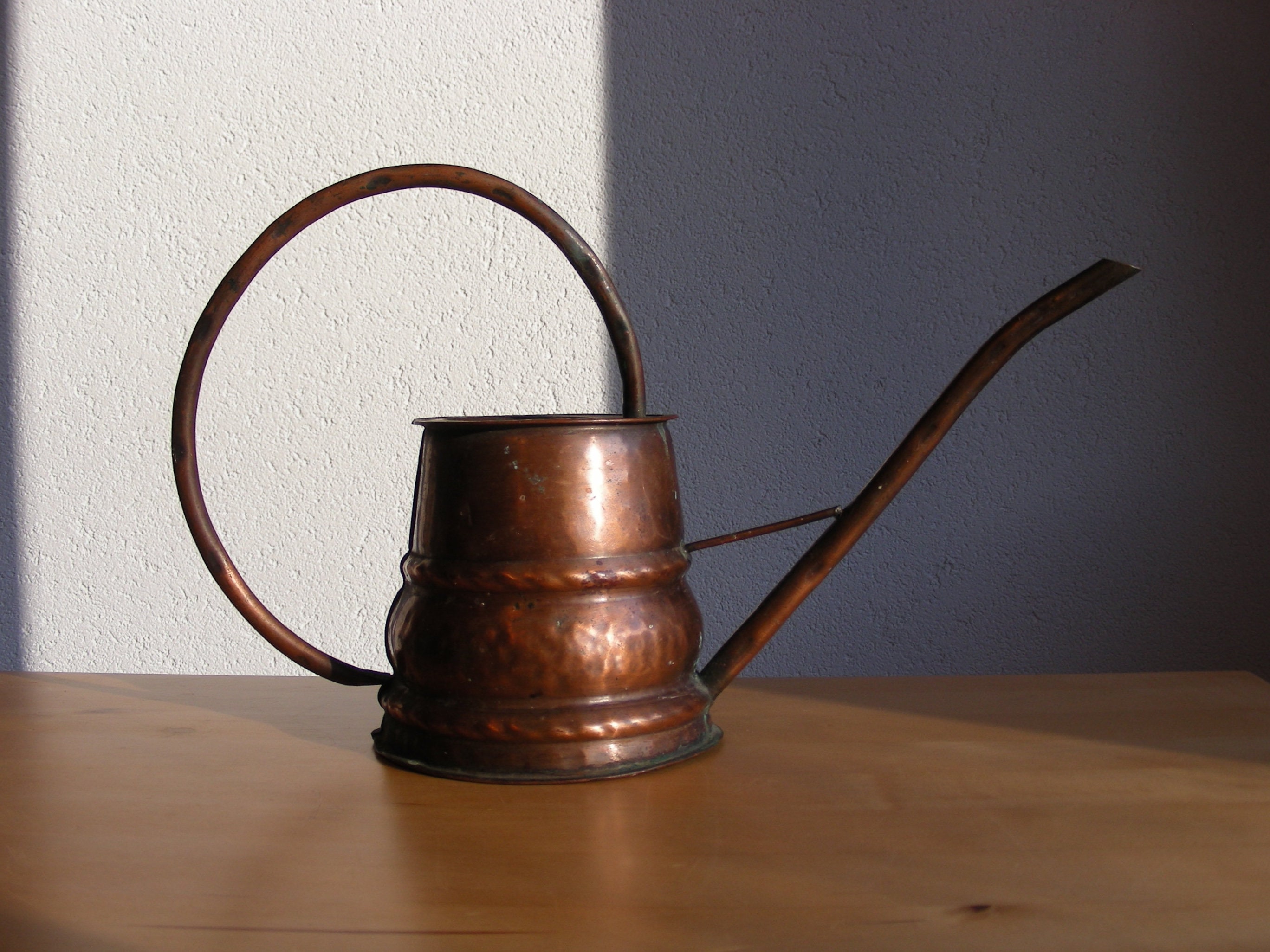 Vintage copper watering can with wonky handle, planter