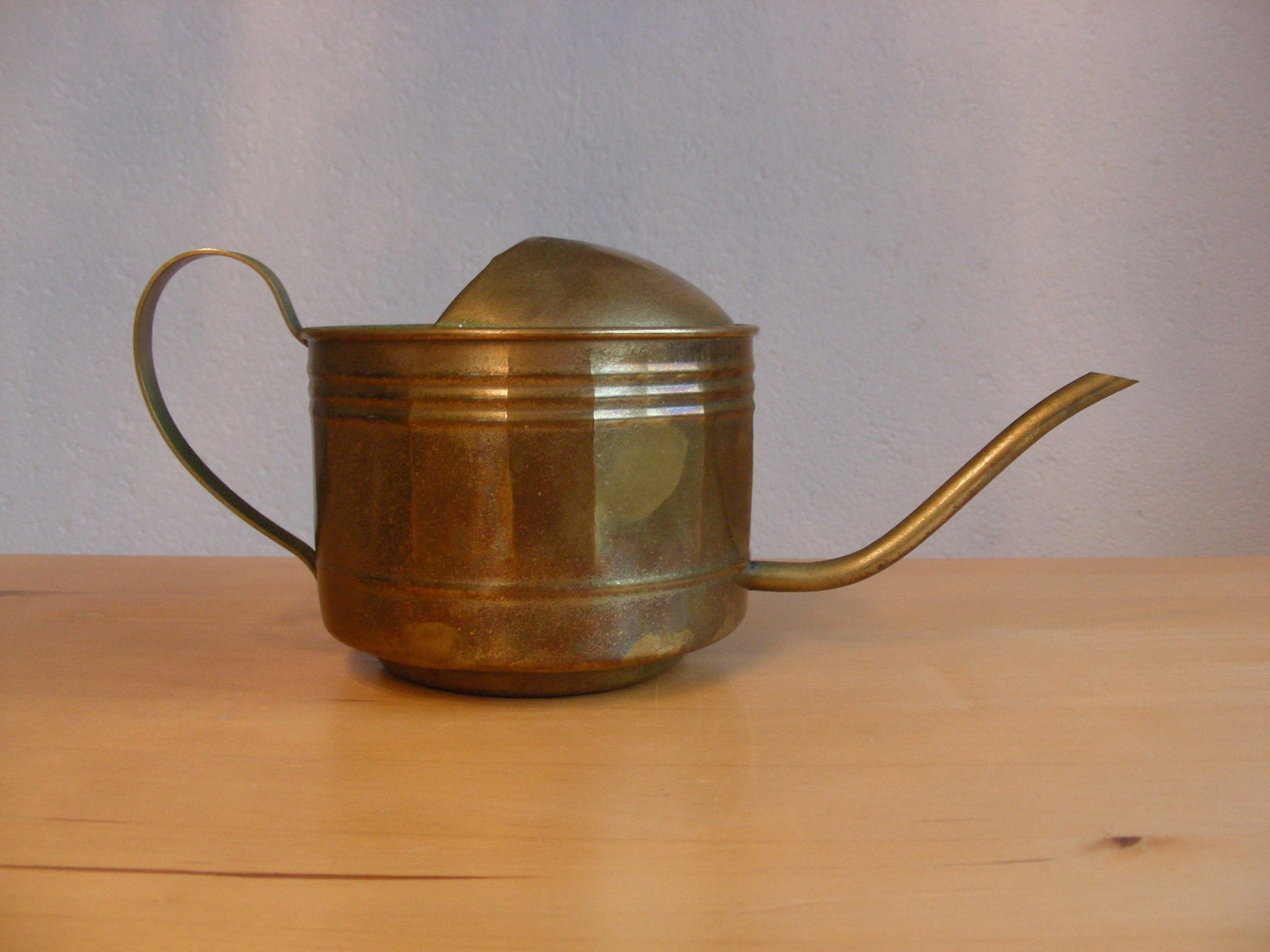 Small, vintage brass watering can