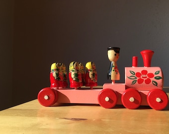 Vintage wooden train with Russian Babushka dolls, Matryoshka