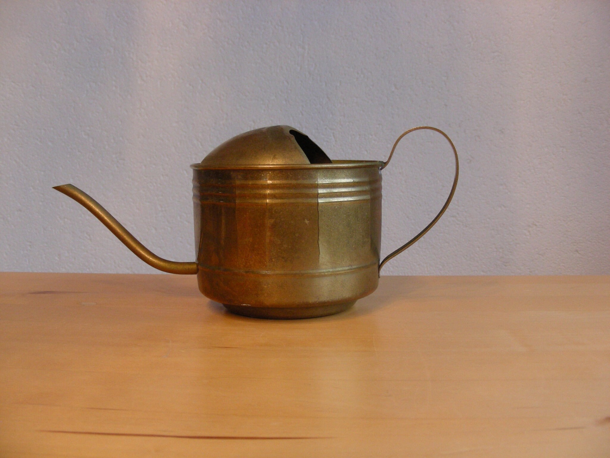 Small, vintage brass watering can