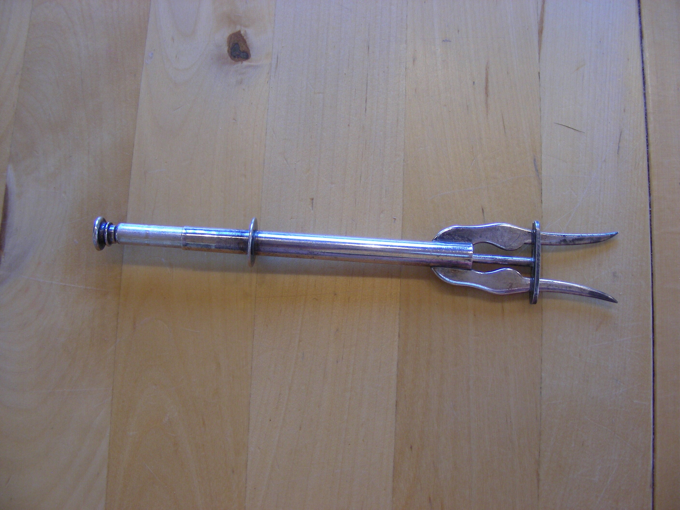 Spring loaded pickle fork, silver plated vintage