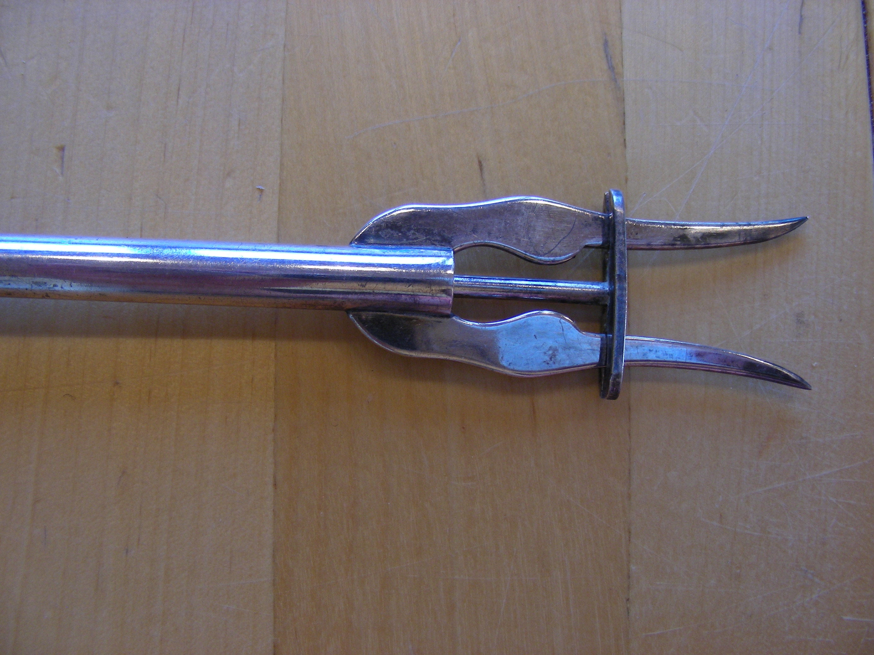 Spring loaded pickle fork, silver plated vintage